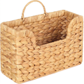 Woven plant fibre wall basket on a plain white background